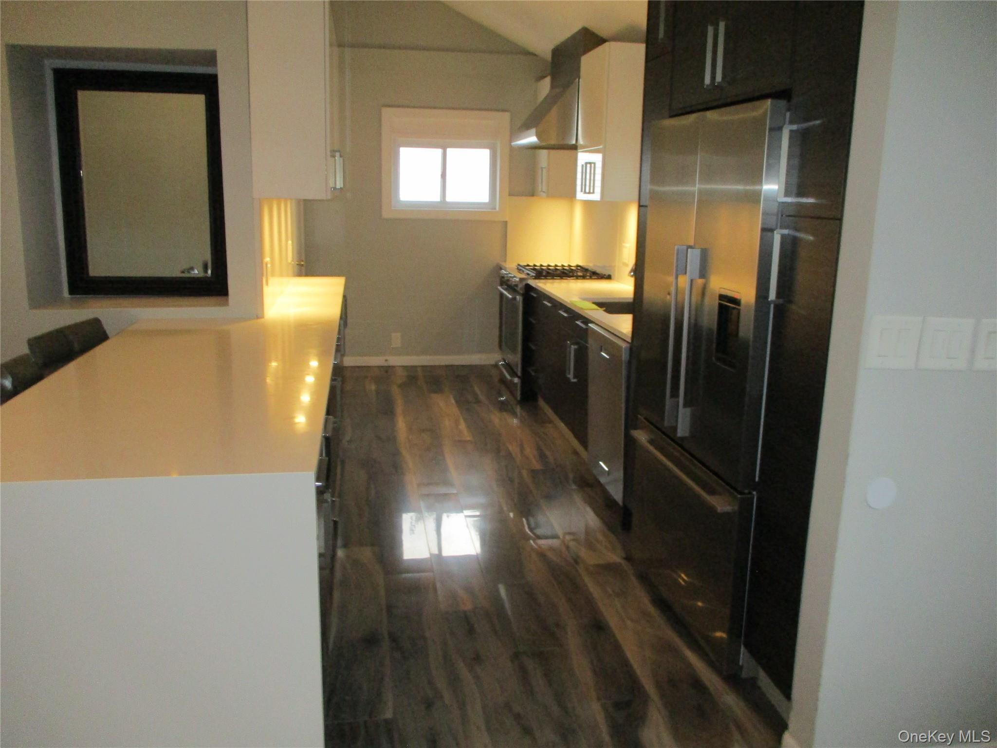 99 North Strathmore Street Valley Stream, NY 11581 - Photo 2 of 12 a view of a kitchen from the hallway