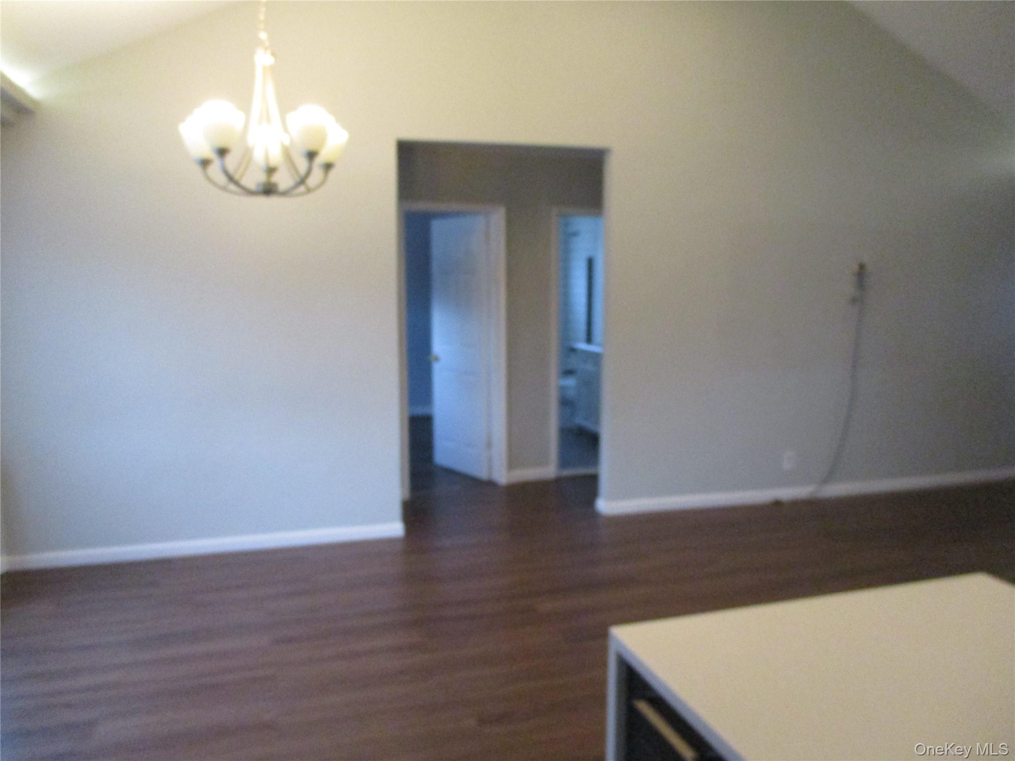 99 North Strathmore Street Valley Stream, NY 11581 - Photo 6 of 12 a view of a hallway with wooden floor