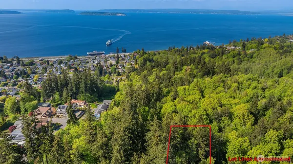 a view of a large body of water with a building in the background