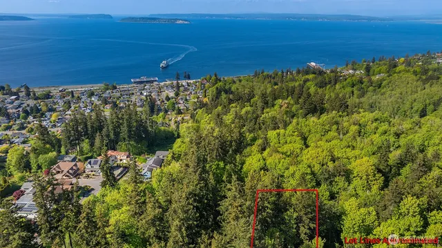 a view of a large body of water with a building in the background