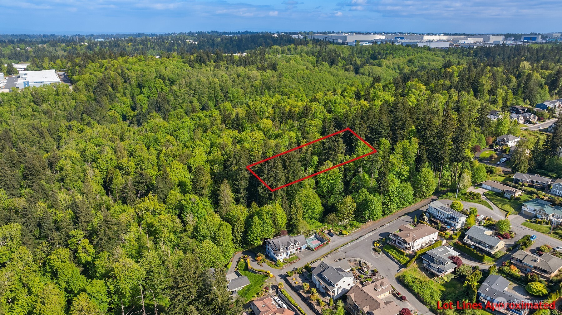 0 Hill Street Mukilteo, WA 98275 - Photo 2 of 5 an aerial view of a residential houses with a yard and mountain view in back