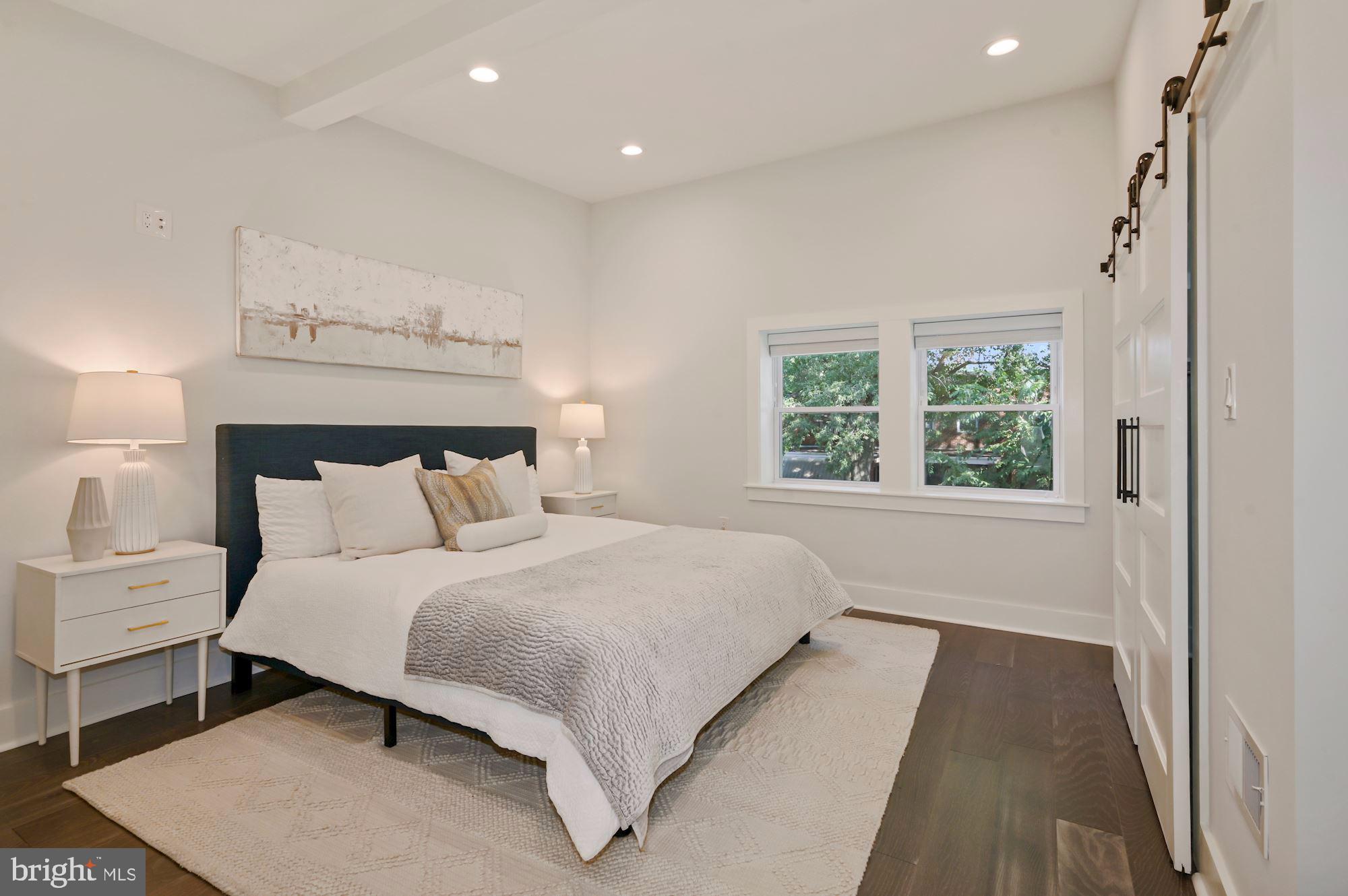418 21st Street Northeast Washington, DC 20002 - Photo 15 of 48 a bedroom with a bed and a window