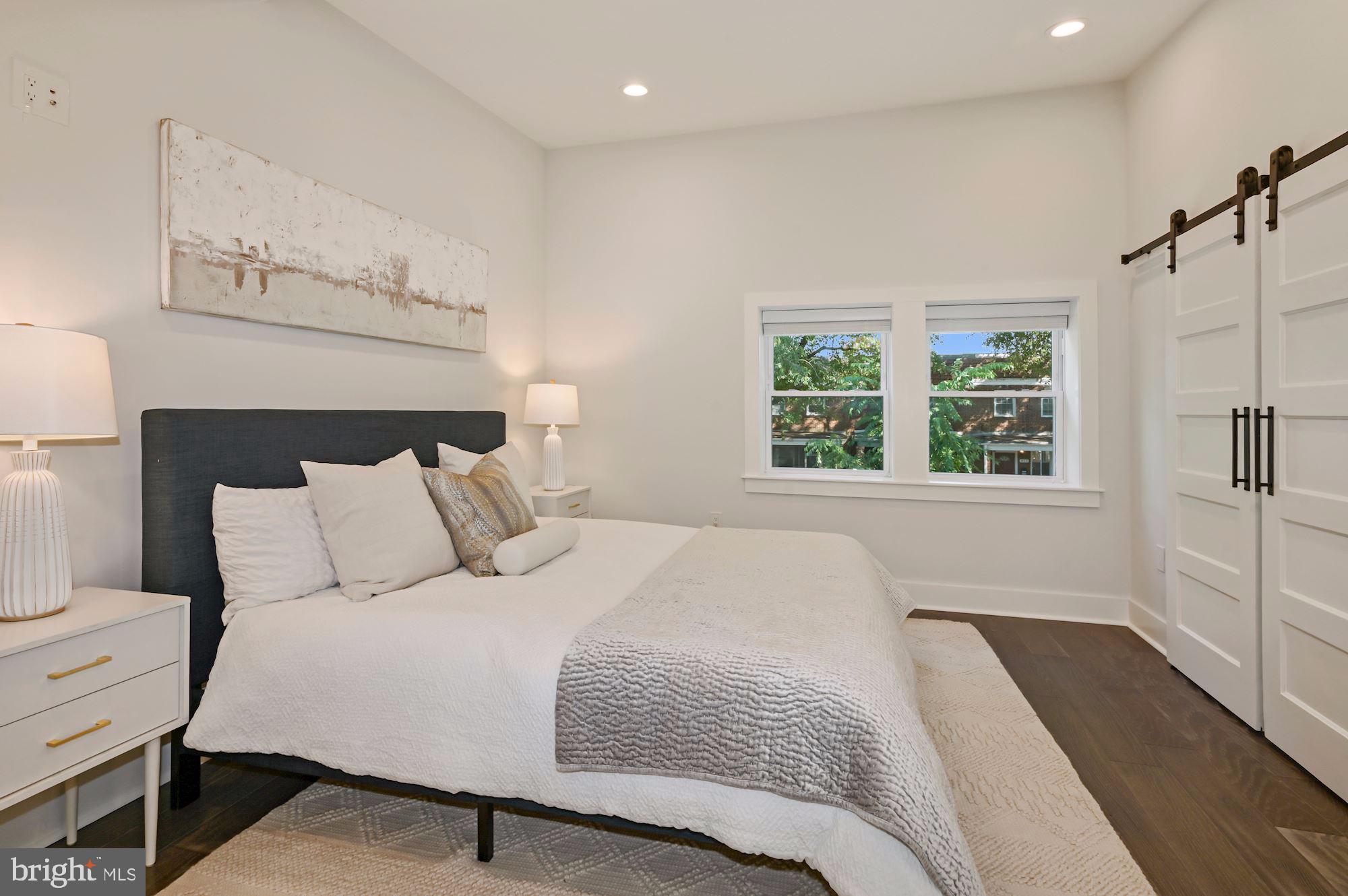 418 21st Street Northeast Washington, DC 20002 - Photo 16 of 48 a bedroom with a large bed and a window