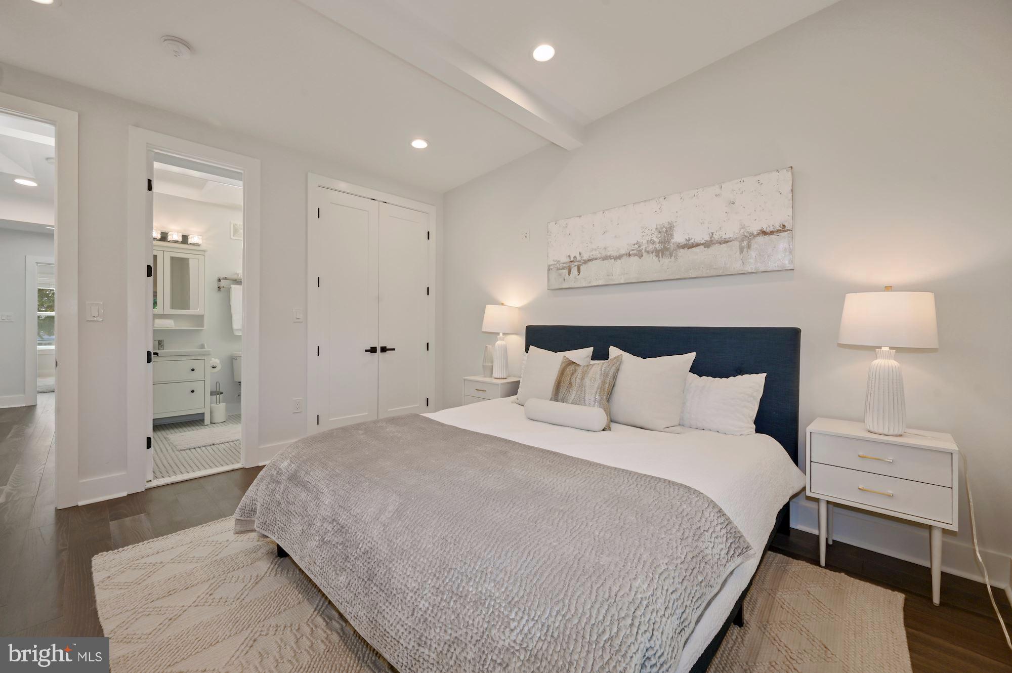 418 21st Street Northeast Washington, DC 20002 - Photo 17 of 48 a large bed sitting in a bedroom and table