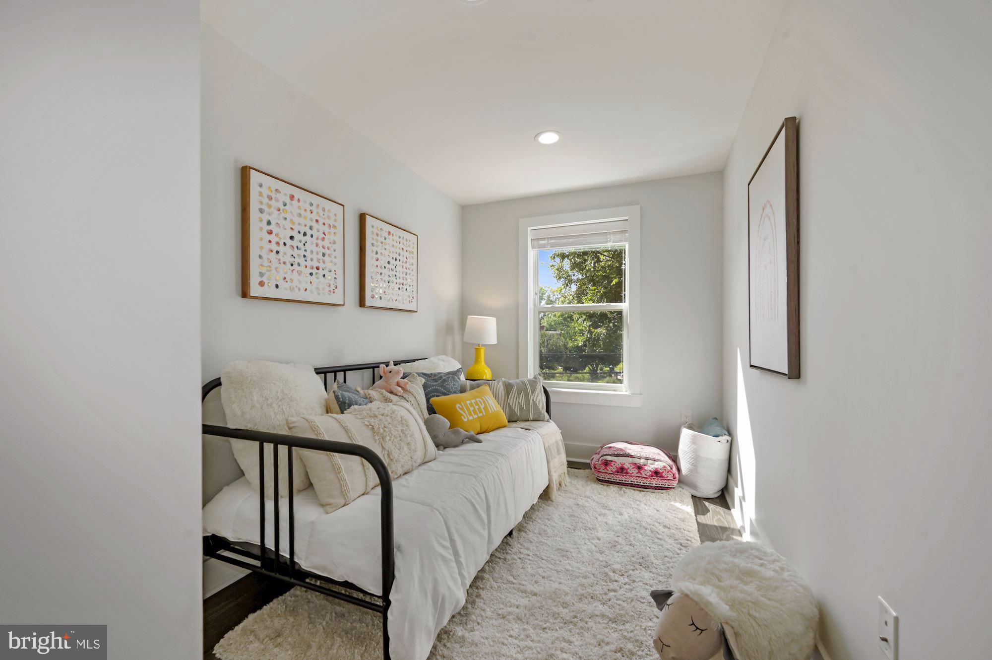 418 21st Street Northeast Washington, DC 20002 - Photo 23 of 48 a living room with furniture and a window