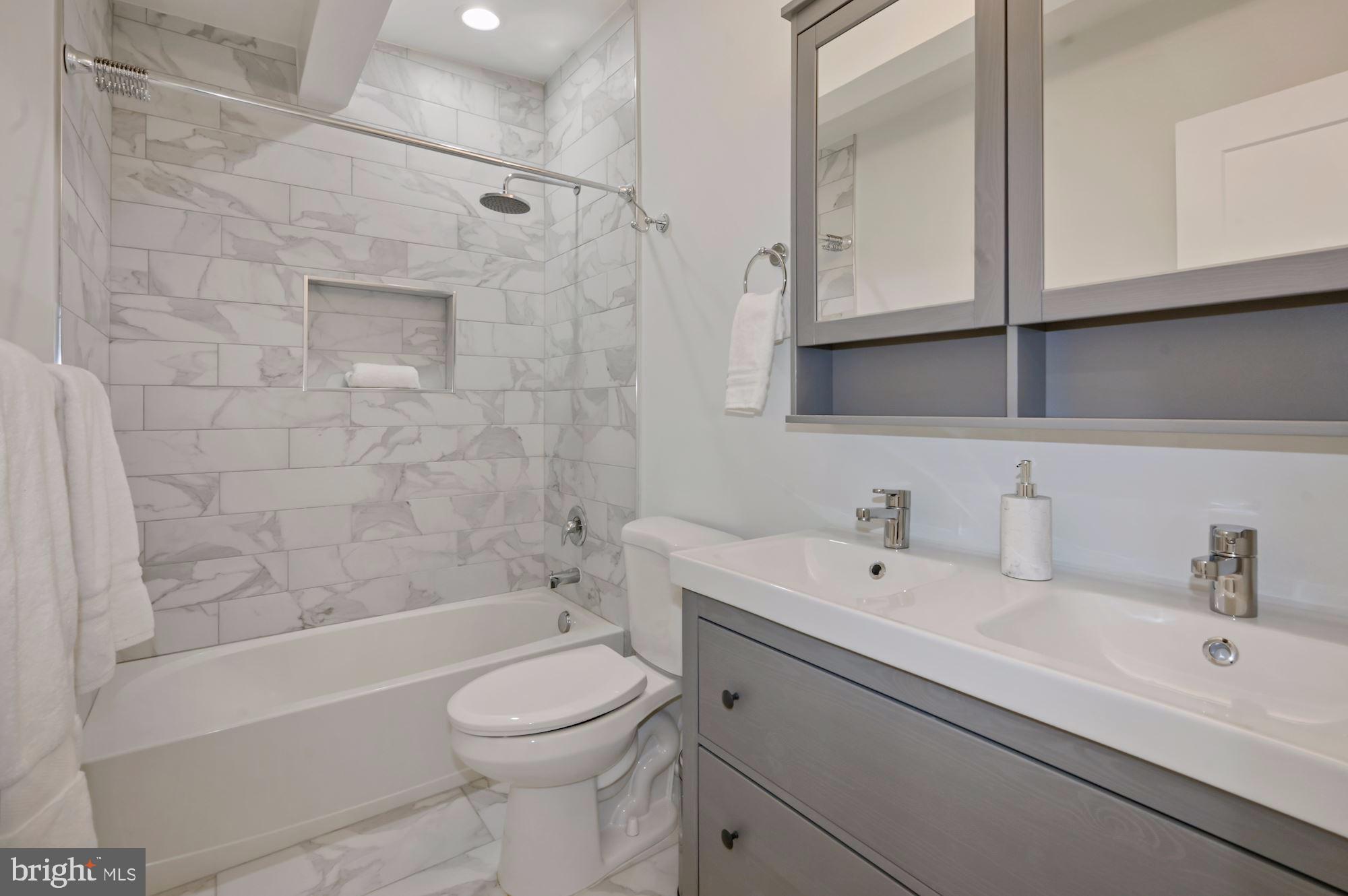 418 21st Street Northeast Washington, DC 20002 - Photo 25 of 48 a bathroom with a sink a toilet and a bathtub