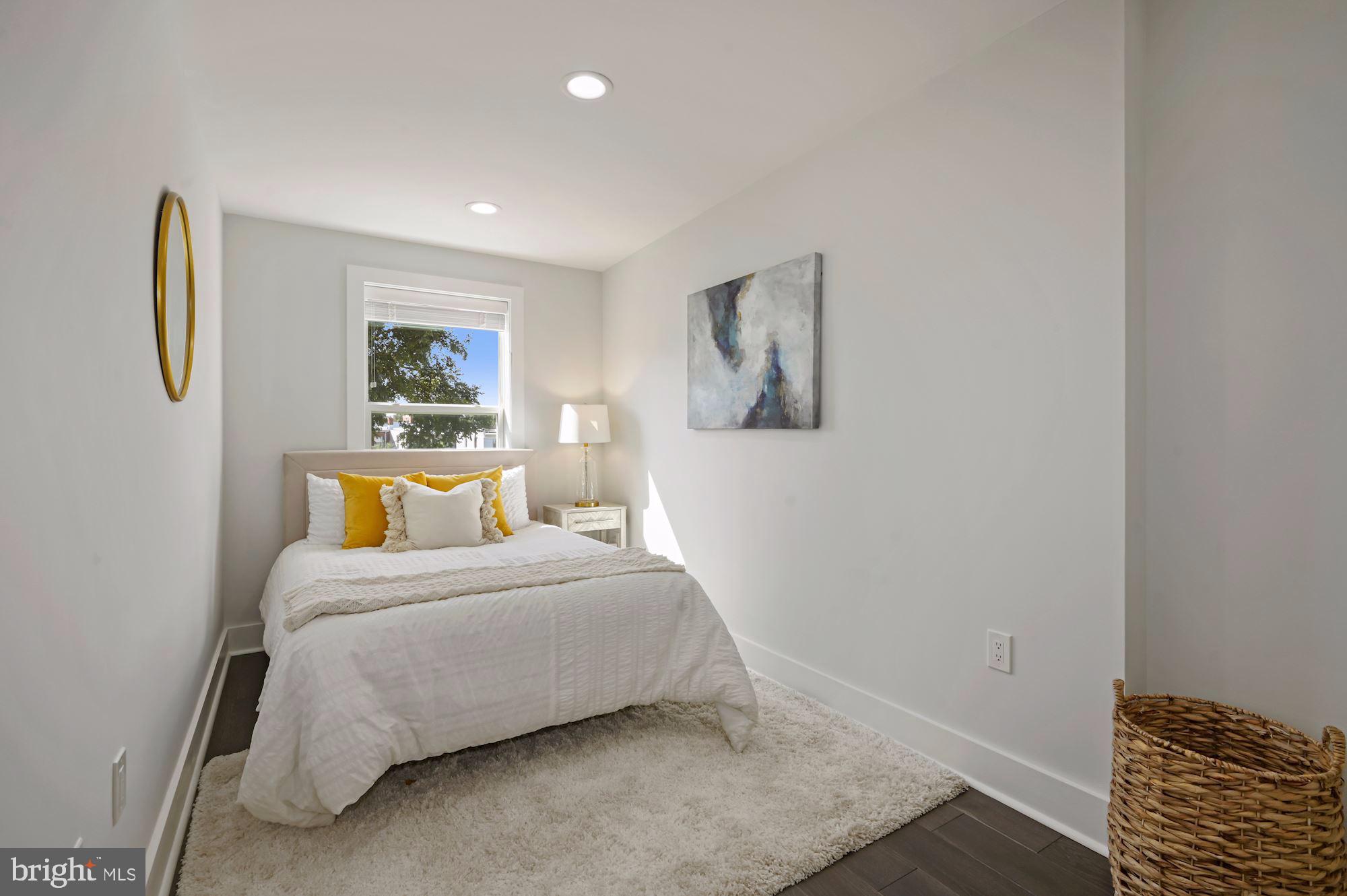 418 21st Street Northeast Washington, DC 20002 - Photo 26 of 48 a bedroom with a bed and a window