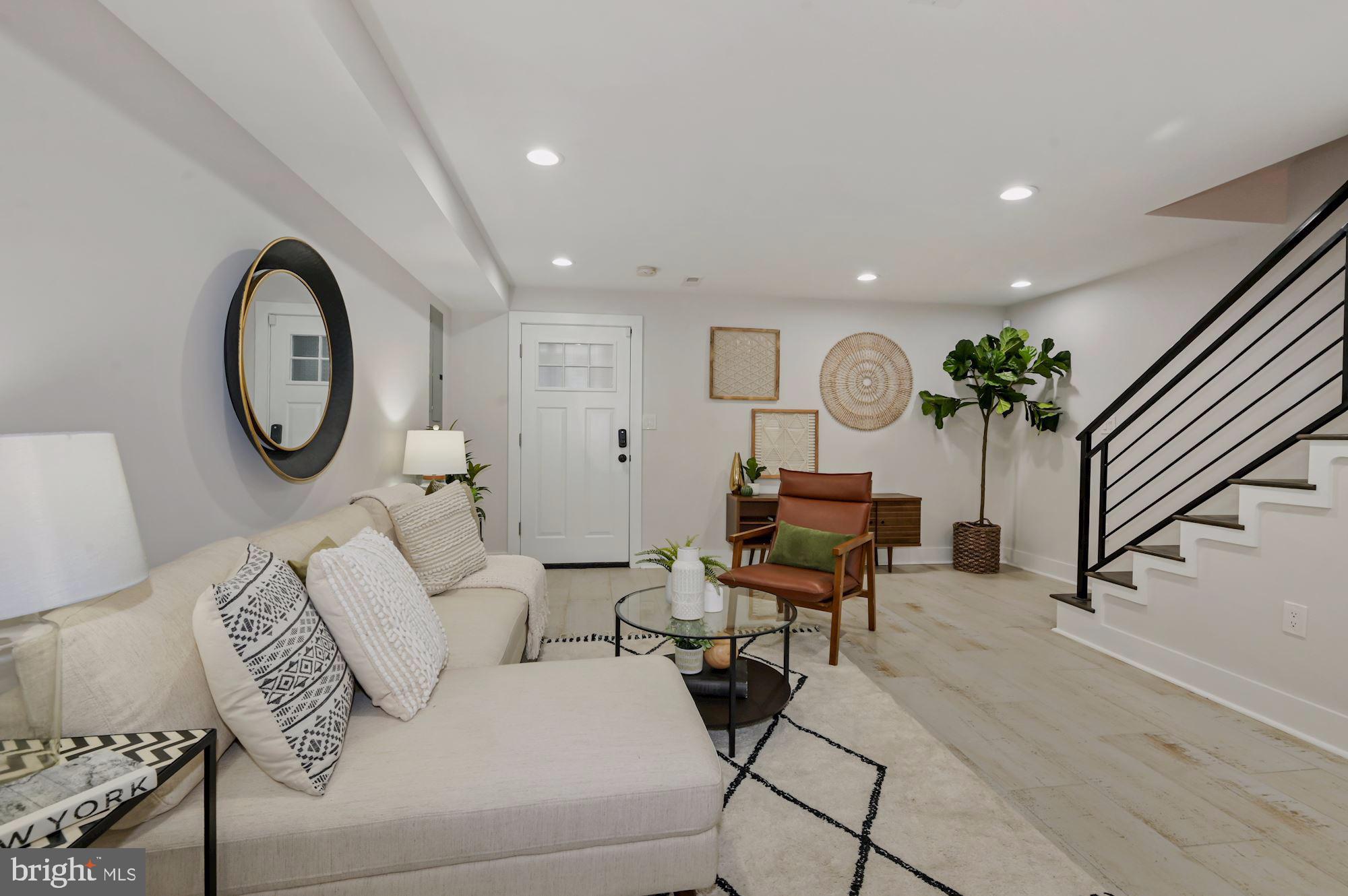 418 21st Street Northeast Washington, DC 20002 - Photo 29 of 48 a living room with furniture a rug and a window