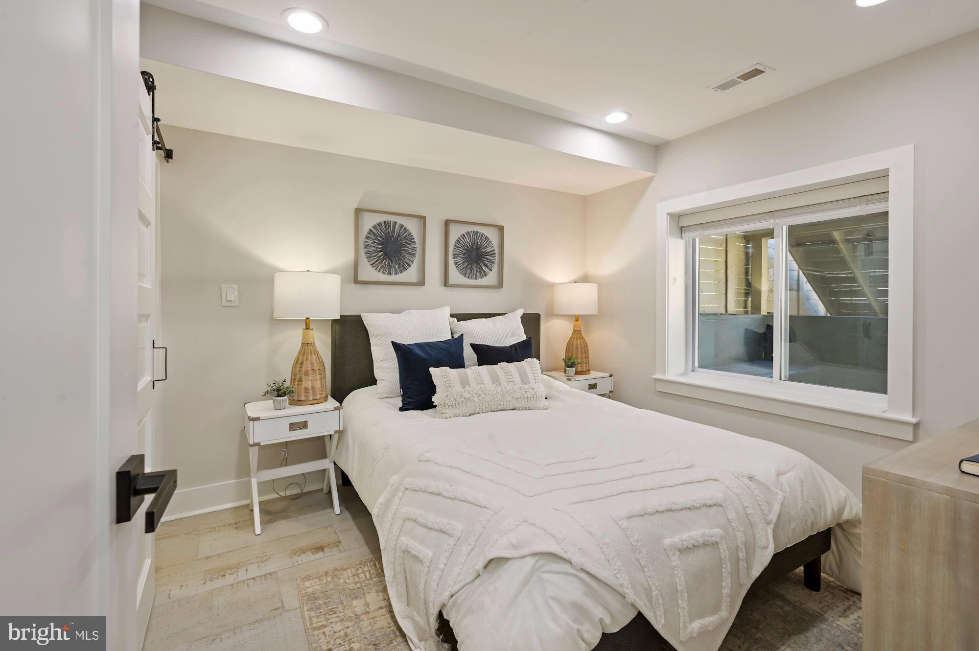 418 21st Street Northeast Washington, DC 20002 - Photo 33 of 48 a bedroom with a bed and window