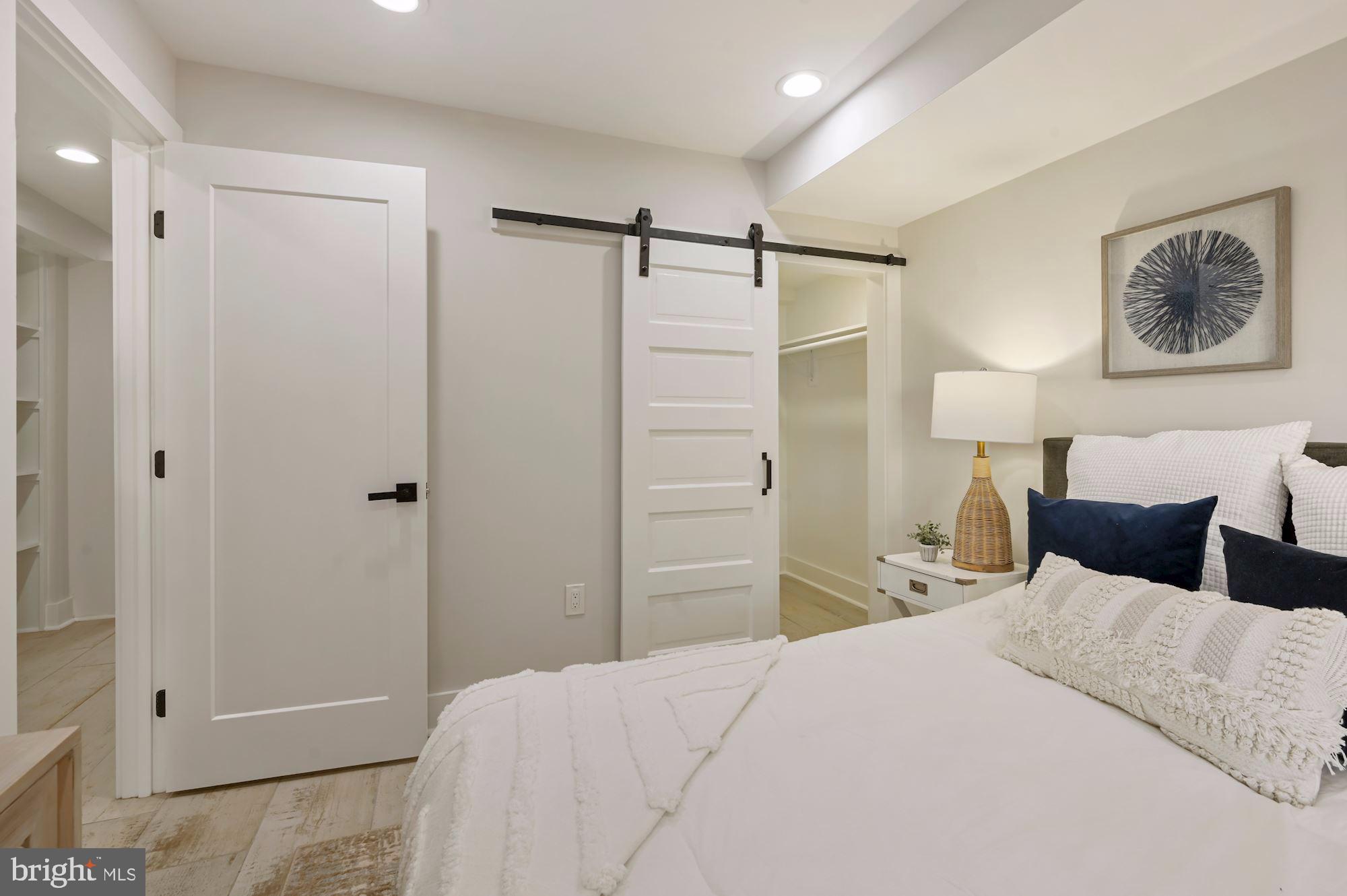 418 21st Street Northeast Washington, DC 20002 - Photo 34 of 48 a bedroom with a bed and a walk in closet