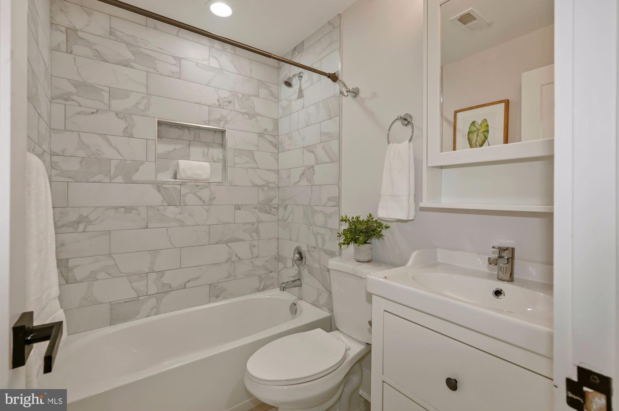 418 21st Street Northeast Washington, DC 20002 - Photo 35 of 48 a bathroom with a sink a toilet and shower