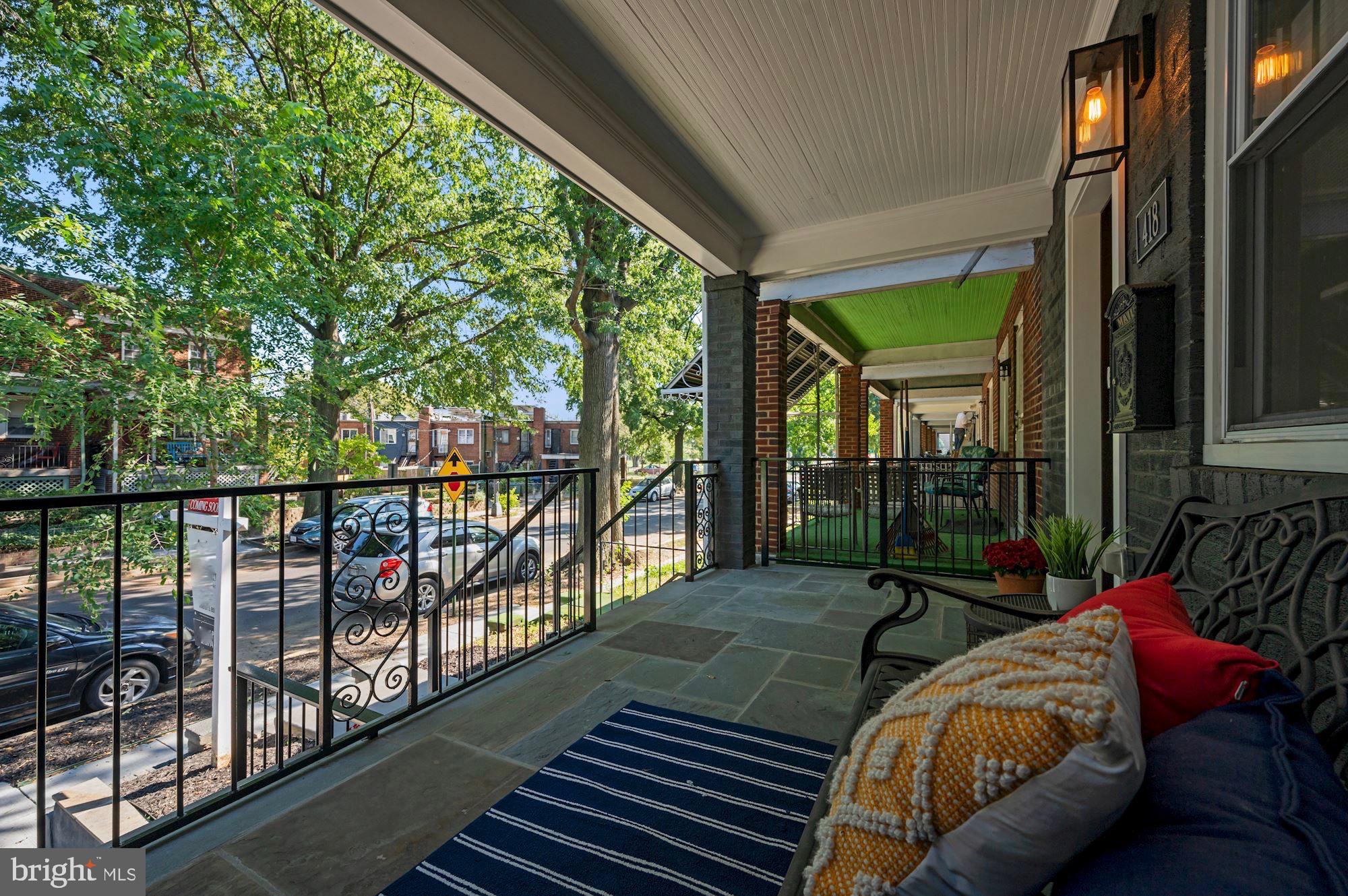 418 21st Street Northeast Washington, DC 20002 - Photo 3 of 48 a balcony with furniture and a potted plant