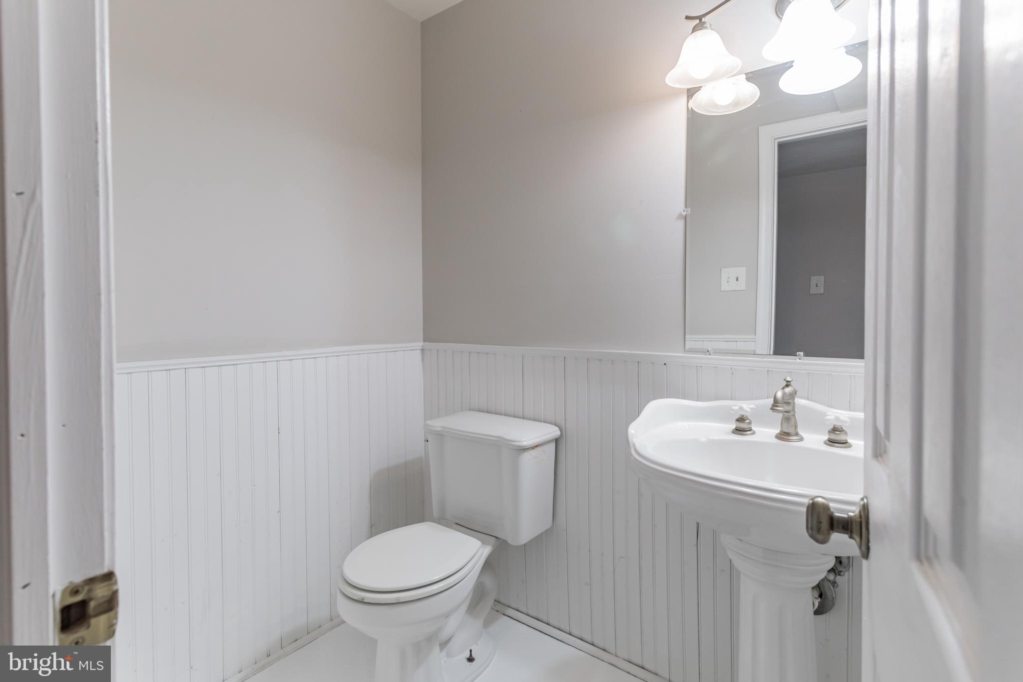 460 Park Road Downingtown, PA 19335 - Photo 22 of 39 1/2 bath off Family Room, new y glazed floors 2020