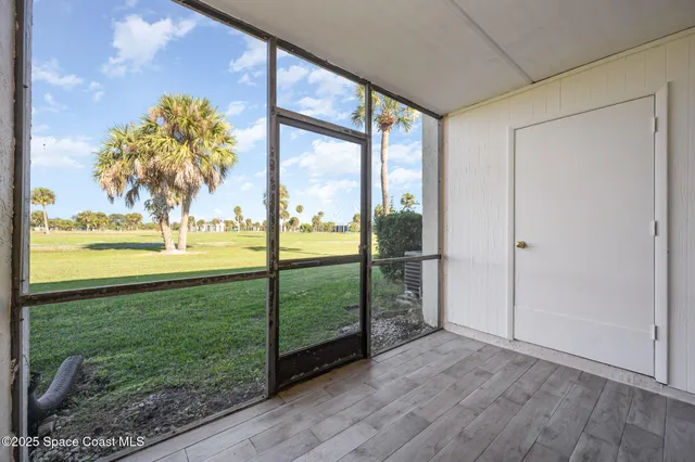 a view of a porch and garden