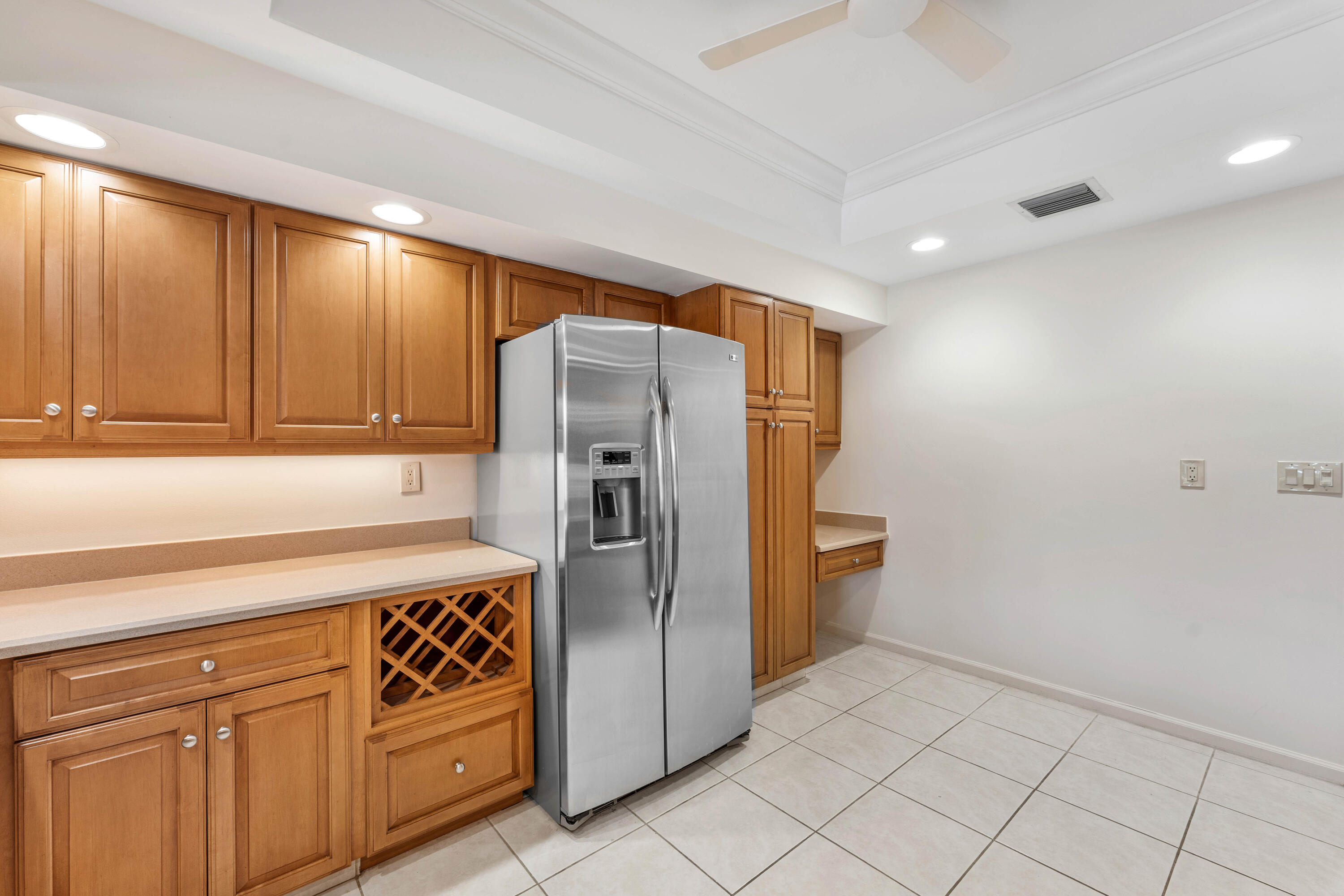 1851 Thatch Palm Drive Boca Raton, FL 33432 - Photo 29 of 70 a kitchen with stainless steel appliances a refrigerator and cabinets