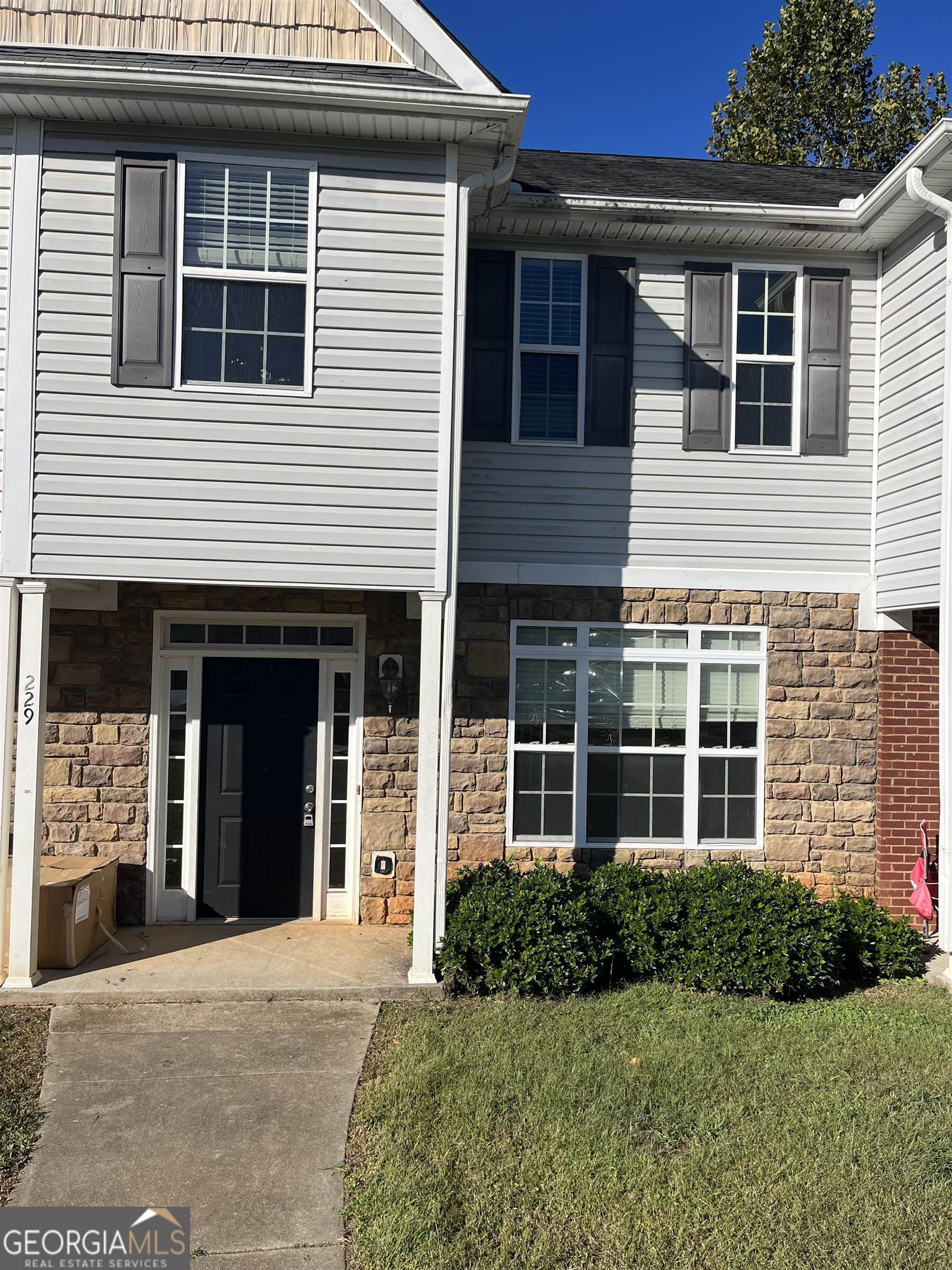 229 Timber Wolf Trail Griffin, GA 30224 - Photo 1 of 1 a front view of a house with a yard and garage