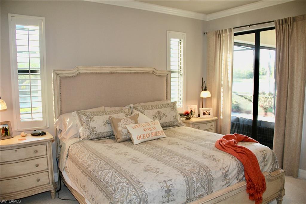 9449 Rialto Drive Naples, FL 34113 - Photo 30 of 44 a bedroom with a bed and a window