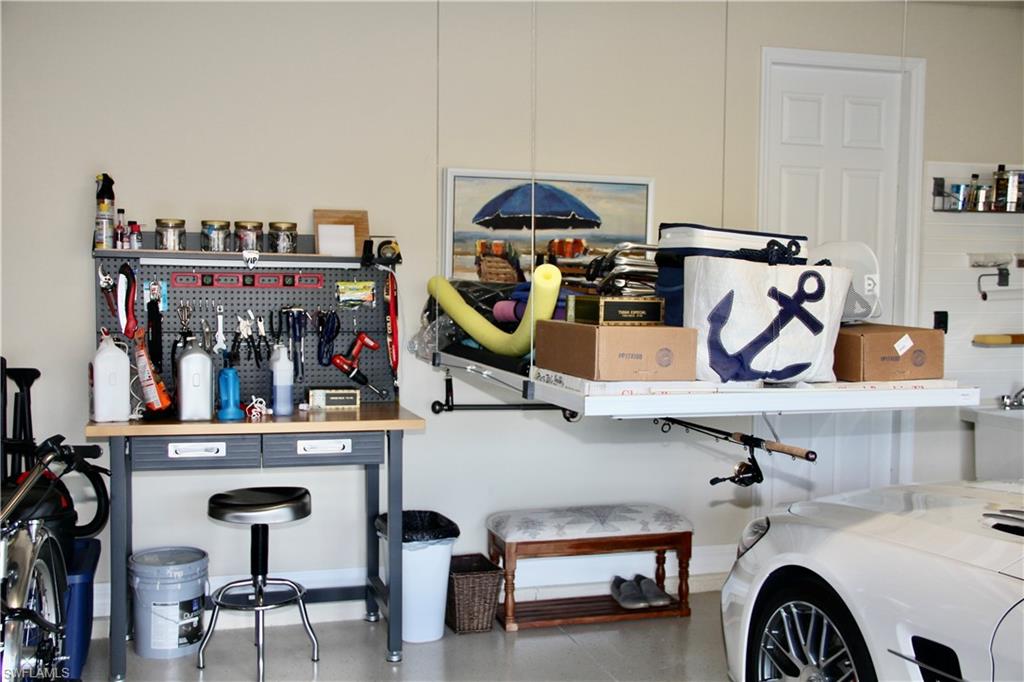 9449 Rialto Drive Naples, FL 34113 - Photo 43 of 44 a view of a room with gym equipment