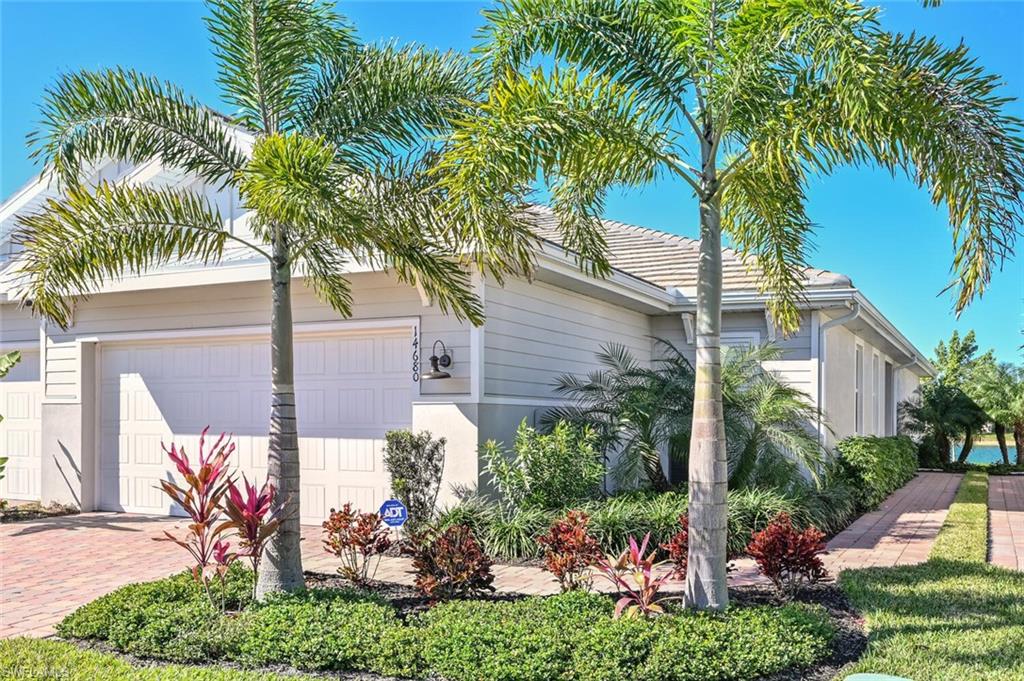 14680 Edgewater Circle Naples, FL 34114 - Photo 1 of 21 a view of a backyard with a plants