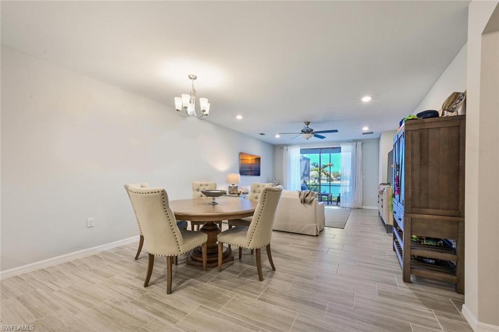 14680 Edgewater Circle Naples, FL 34114 - Photo 4 of 21 a view of a dining room with furniture