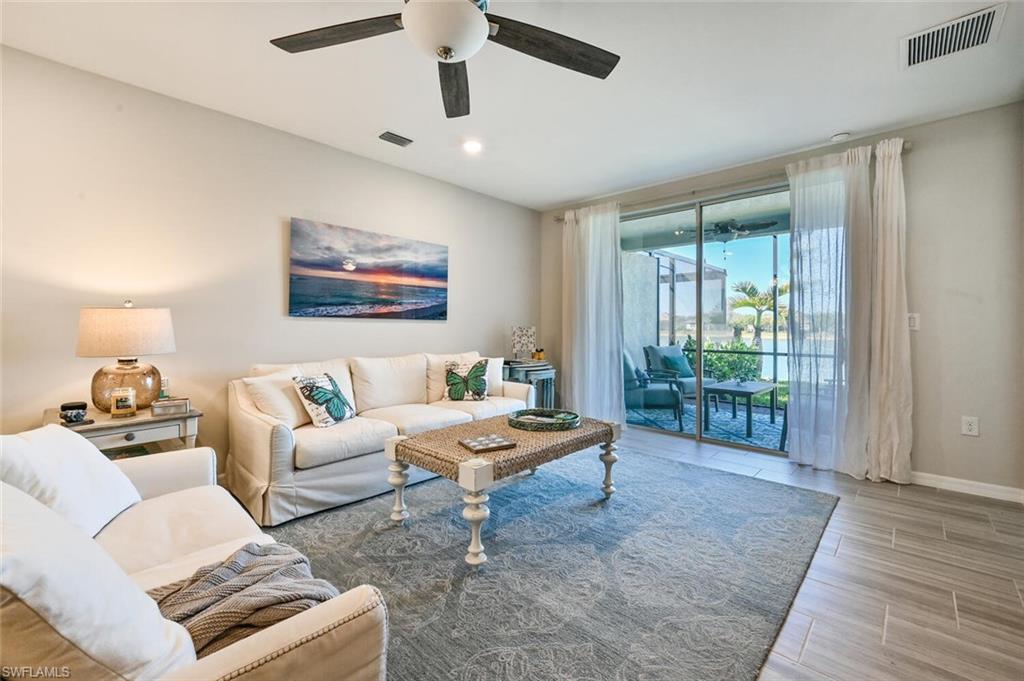 14680 Edgewater Circle Naples, FL 34114 - Photo 5 of 21 a living room with furniture