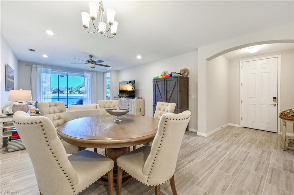 14680 Edgewater Circle Naples, FL 34114 - Photo 9 of 21 a view of a dining room with furniture