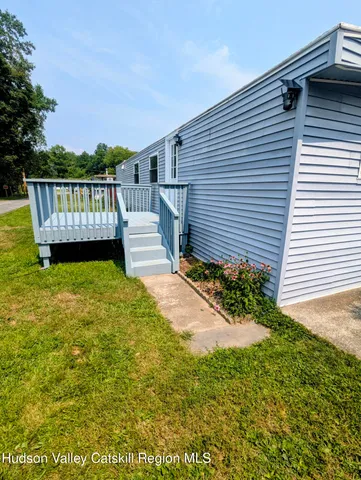 a kitchen with granite countertop a sink a stove and cabinets