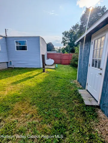 a backyard of a house with lots of green space