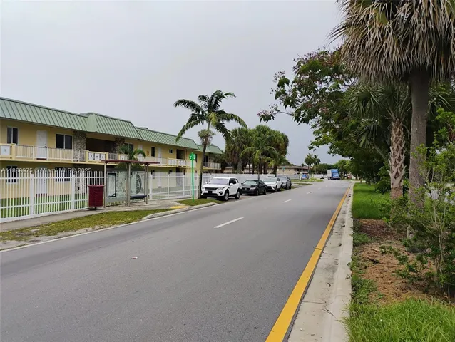 a swimming pool with outdoor seating and yard