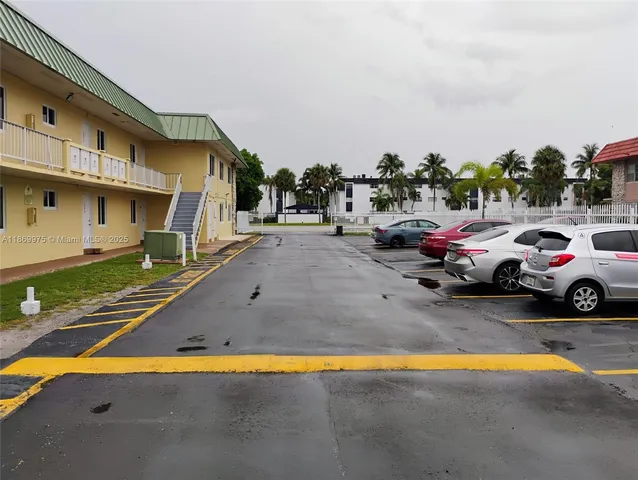 a view of a street with cars