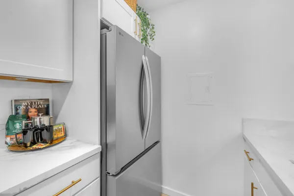 a kitchen with stainless steel appliances granite countertop a stove a microwave and cabinets