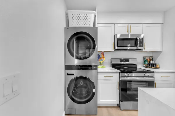 a living room with furniture and a rug