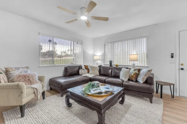 a living room with furniture and a large window