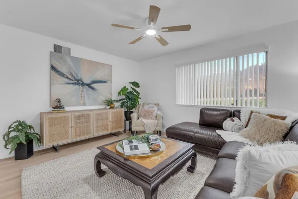 a living room with furniture and a window