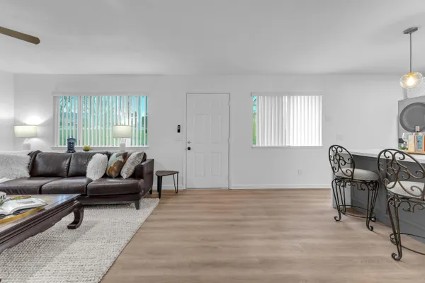 a view of an entryway with wooden floor