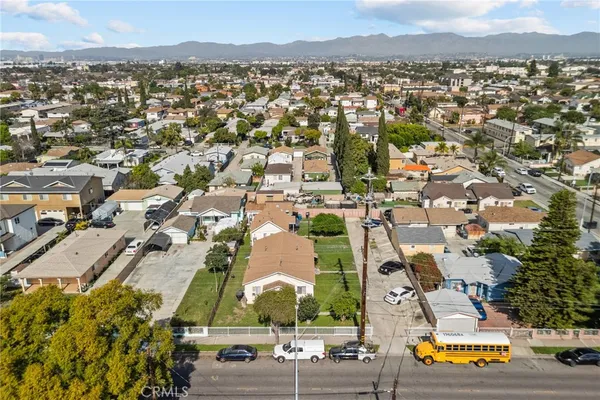 an aerial view of residential houses with outdoor space