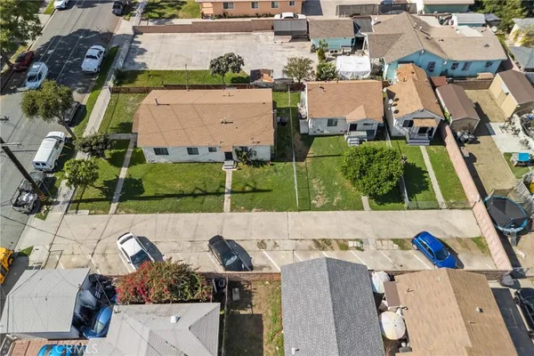 an aerial view of a house with a swimming pool