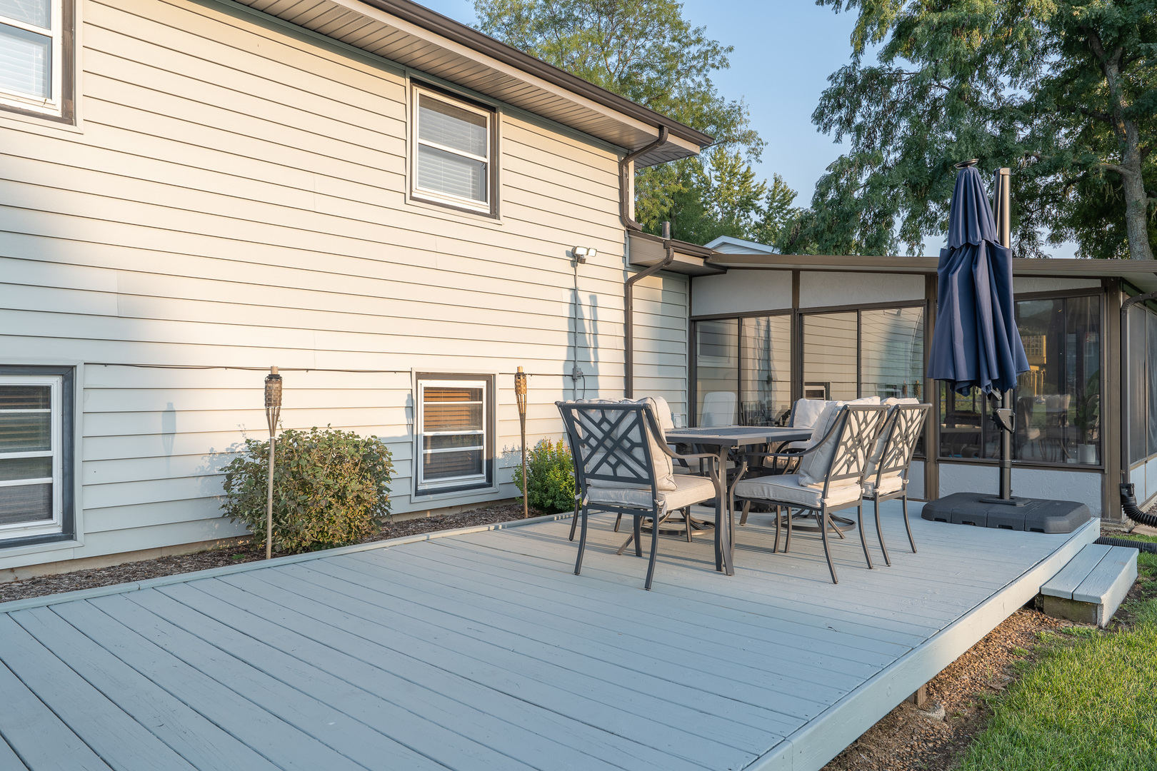 817 Southgate Road New Lenox, IL 60451 - Photo 4 of 30 a view of a roof deck with table and chairs and wooden floor