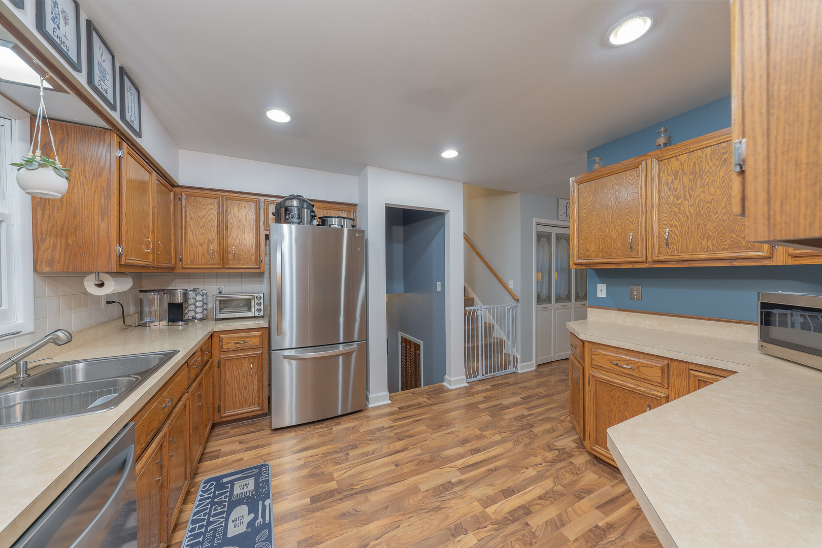 817 Southgate Road New Lenox, IL 60451 - Photo 8 of 30 a kitchen with stainless steel appliances granite countertop a refrigerator sink and cabinets