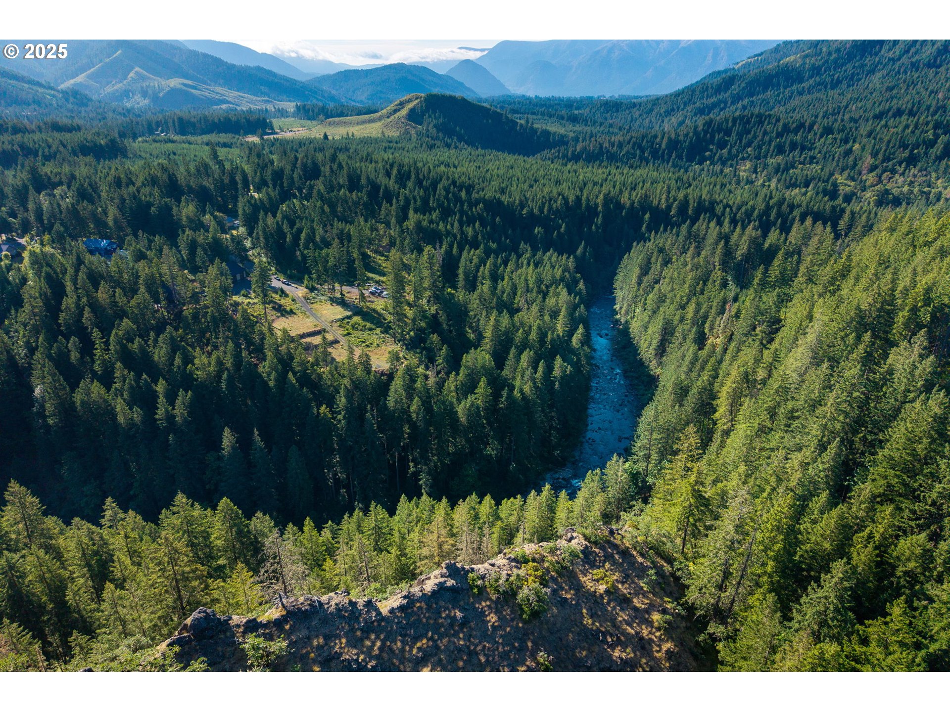 Boulder Ridge Carson, WA 98610 - Photo 3 of 26 a view of a lush green hillside and houses