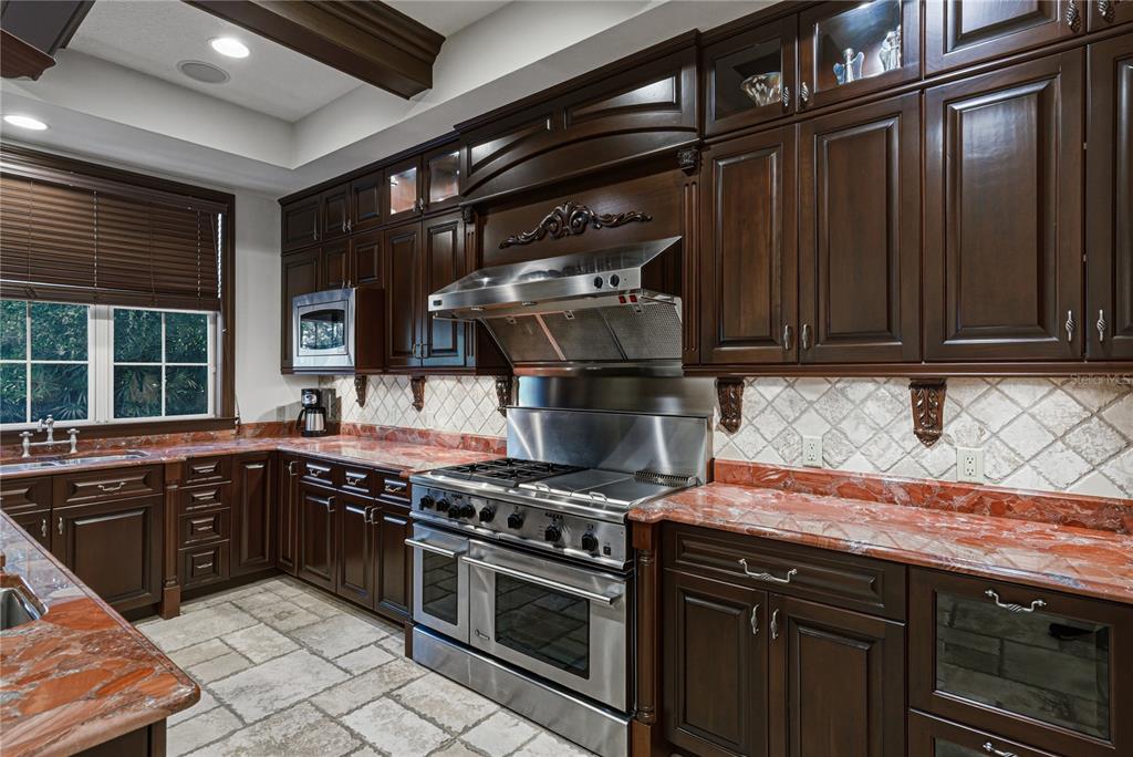3505 Gallagher Road Dover, FL 33527 - Photo 43 of 100 a kitchen with stainless steel appliances granite countertop a stove and a sink