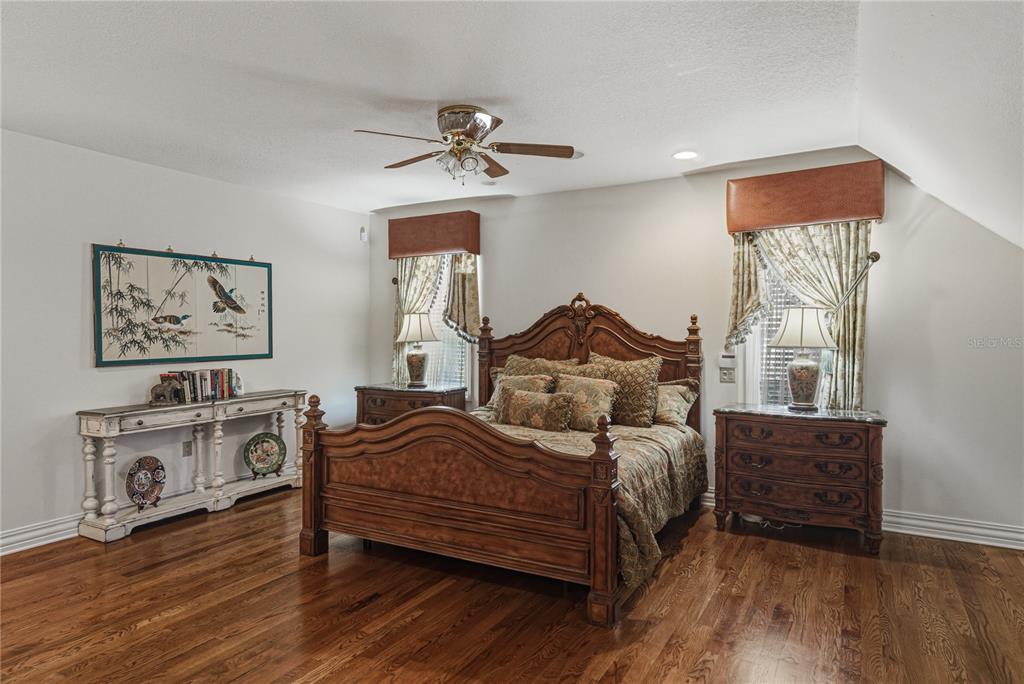 3505 Gallagher Road Dover, FL 33527 - Photo 49 of 100 a bedroom with a bed and wooden floor