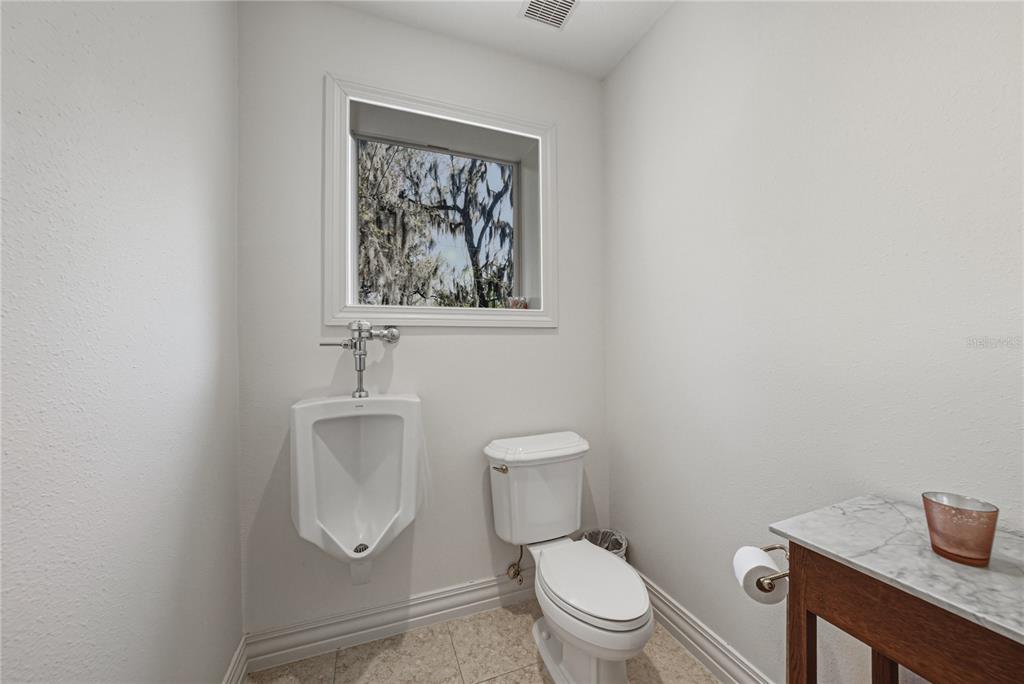 3505 Gallagher Road Dover, FL 33527 - Photo 55 of 100 a white toilet sitting next to a bathroom sink
