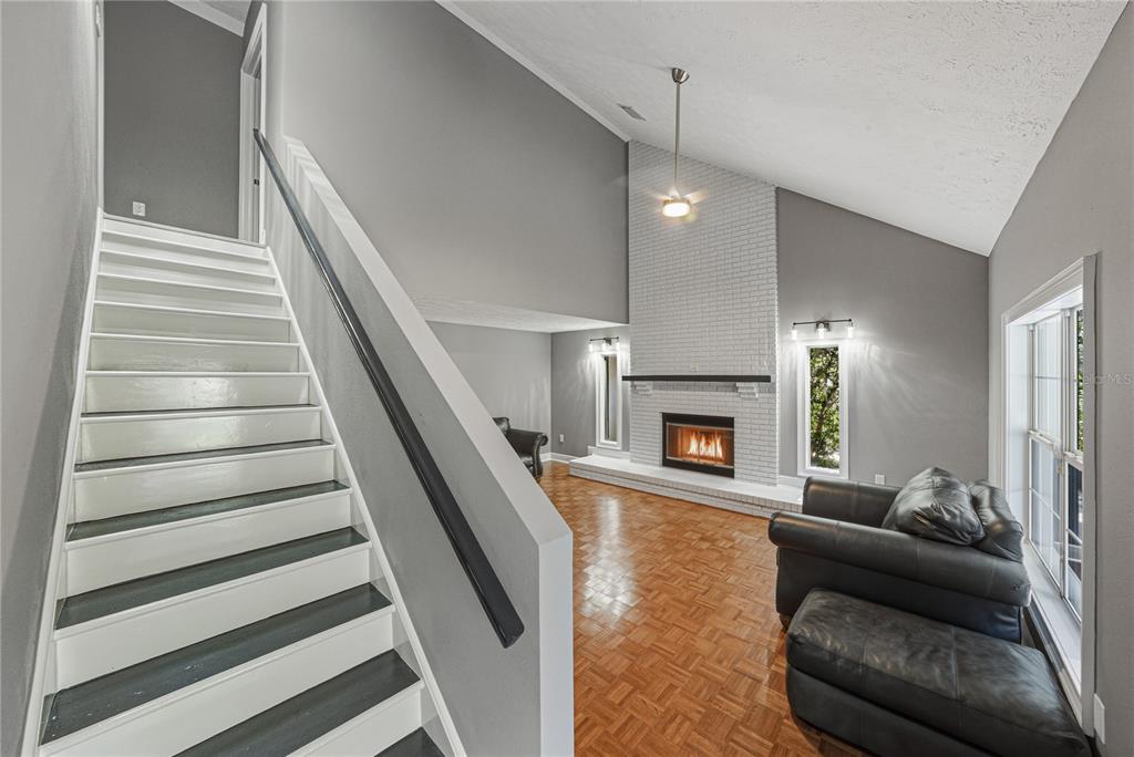 3505 Gallagher Road Dover, FL 33527 - Photo 65 of 100 a living room with furniture and a fireplace