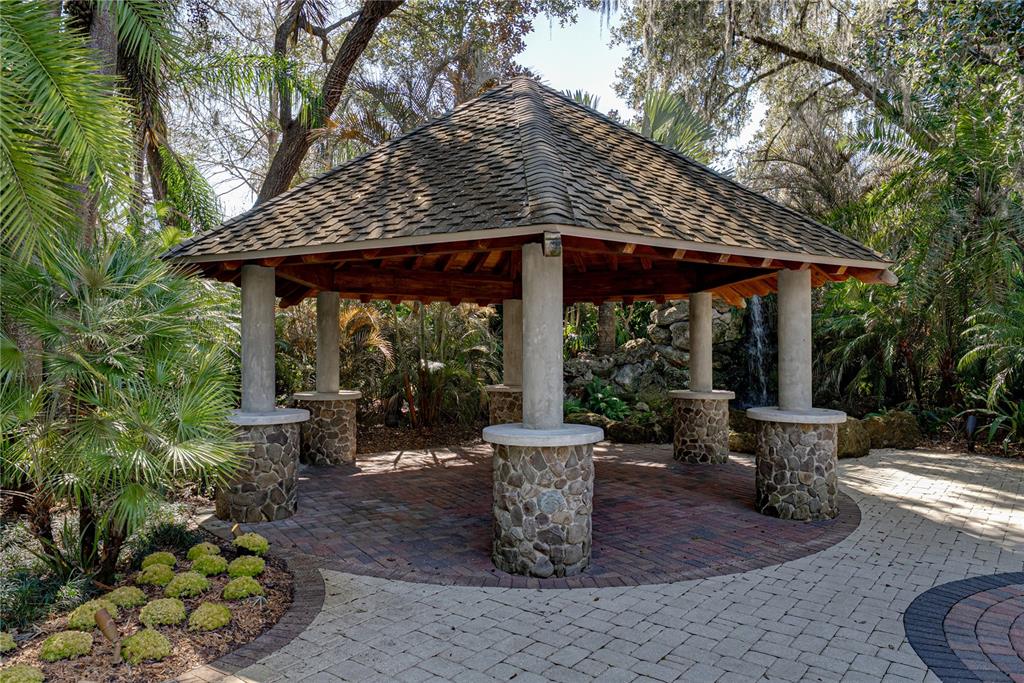 3505 Gallagher Road Dover, FL 33527 - Photo 93 of 100 a view of a patio with table and chairs potted plants