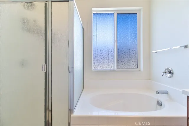a white bath tub sitting in a bathroom