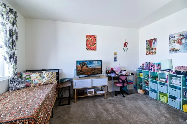 a bedroom with furniture and a bed