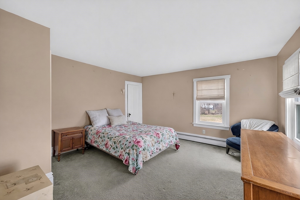 47 Singletary Avenue Sutton, MA 01590 - Photo 15 of 42 a bedroom with a bed chair and a window
