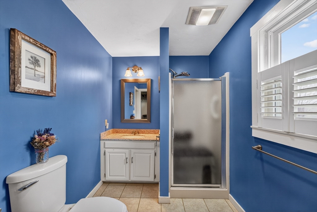 47 Singletary Avenue Sutton, MA 01590 - Photo 17 of 42 a bathroom with a toilet sink and mirror