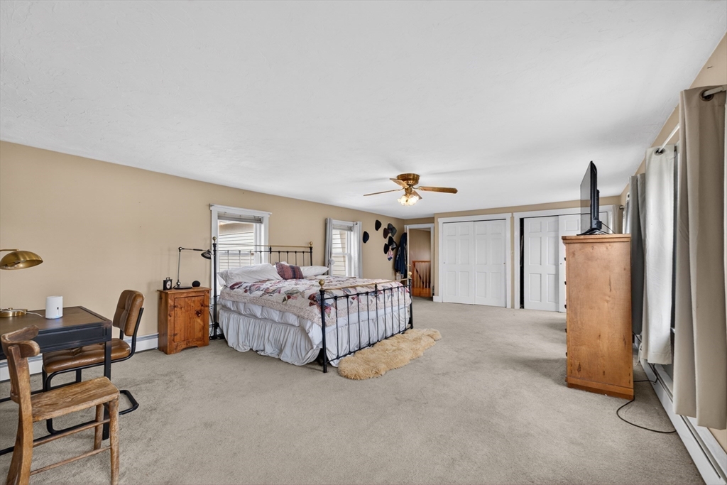 47 Singletary Avenue Sutton, MA 01590 - Photo 22 of 42 a bedroom with furniture and a window